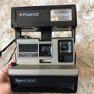 Polaroid Spirit 600 instant camera with neck strap